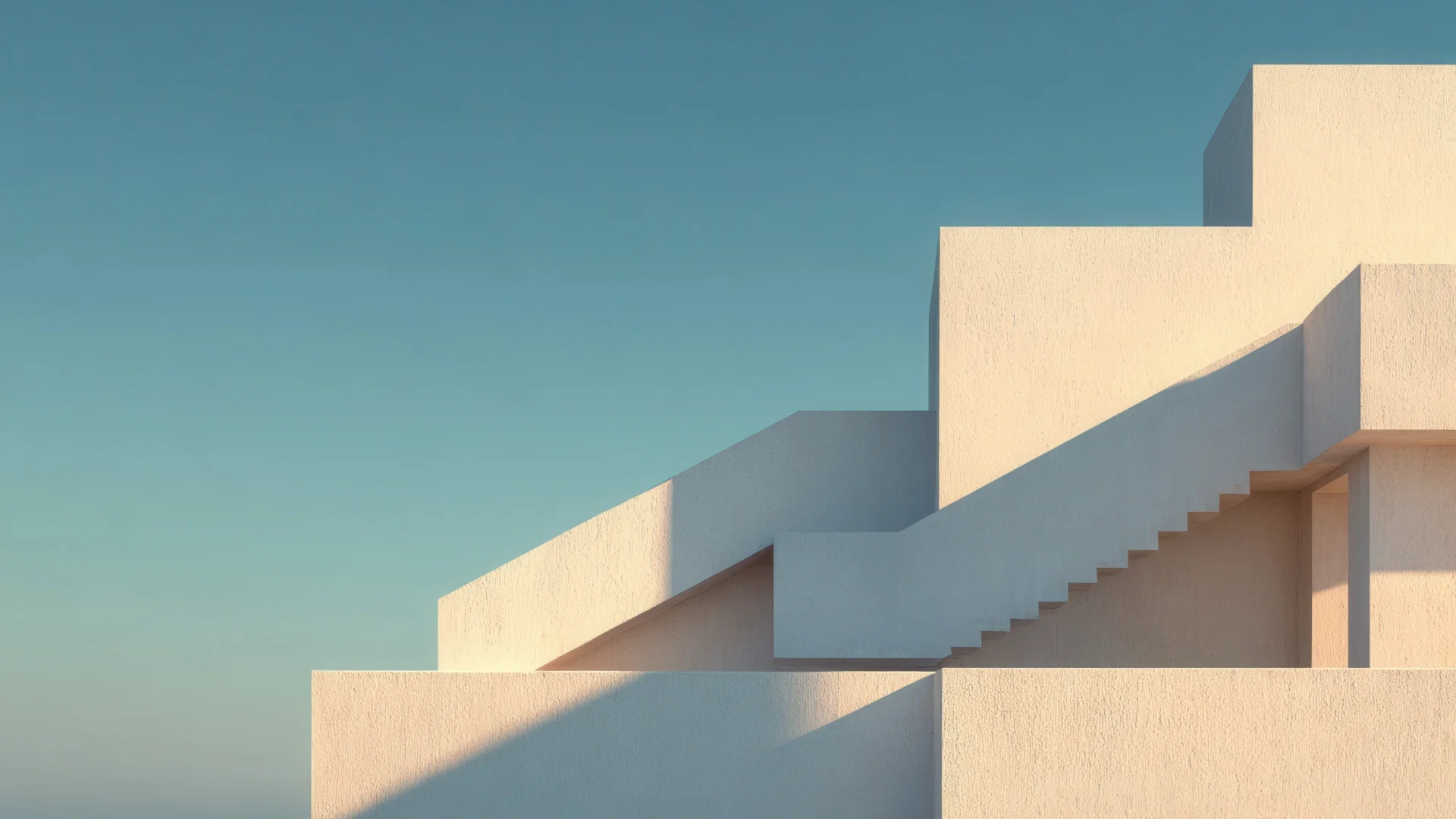 Bâtiment moderne aux formes géométriques avec escalier extérieur au soleil